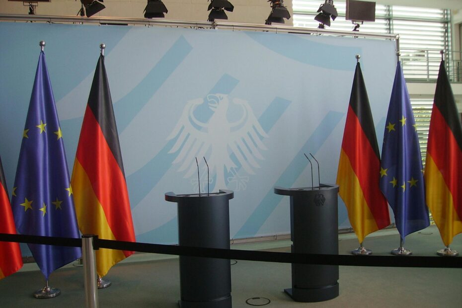 Empty podiums with German and EU flags in Federal Chancellery, Berlin.