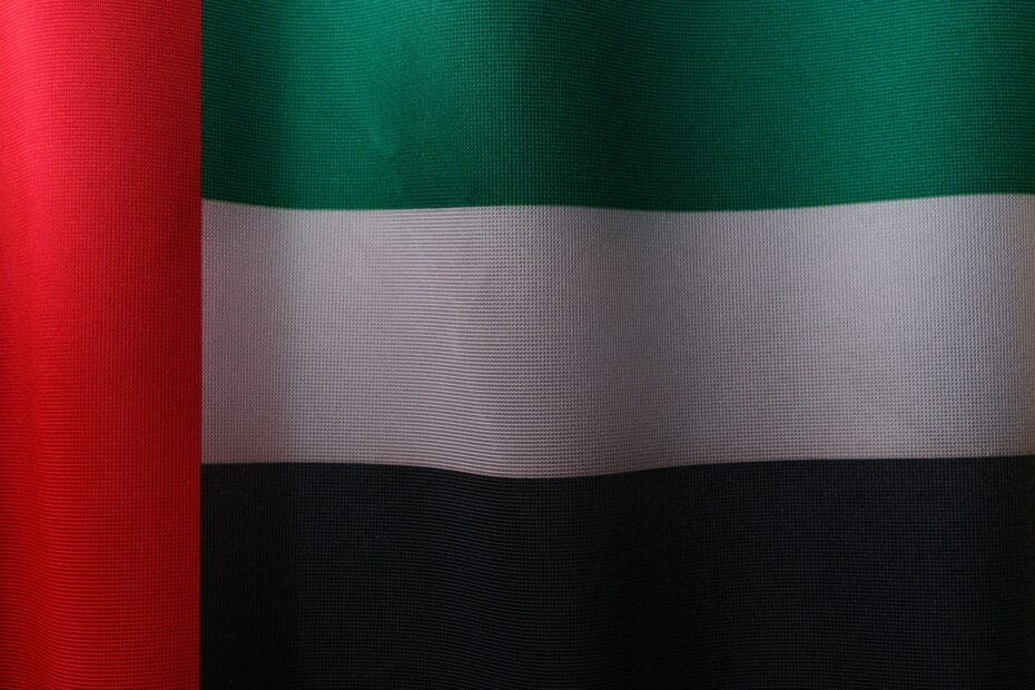 Detailed close-up of the United Arab Emirates flag with vibrant colors and fabric texture.