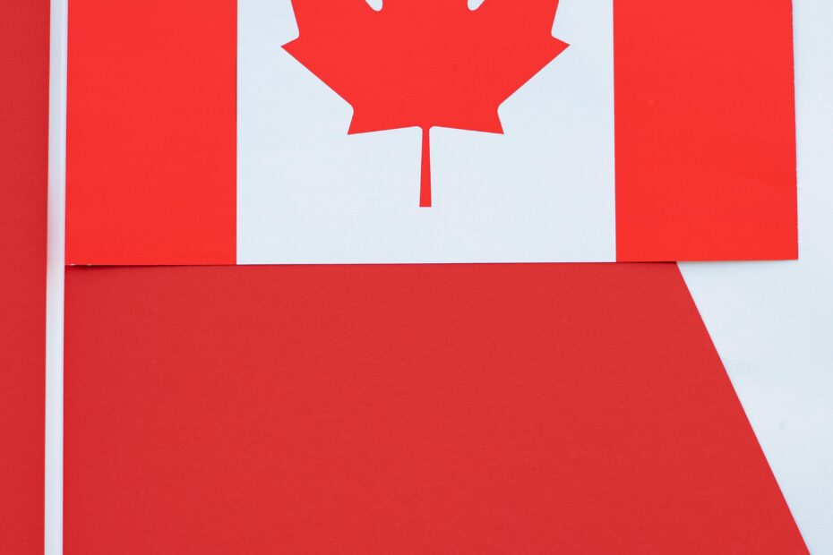 A crisp close-up photo of the Canadian flag, emphasizing the red and white colors.